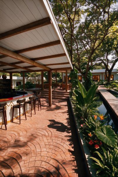 Cobble-stamped floors surrounded by tropical foliage at The Bab, the island restaurant.