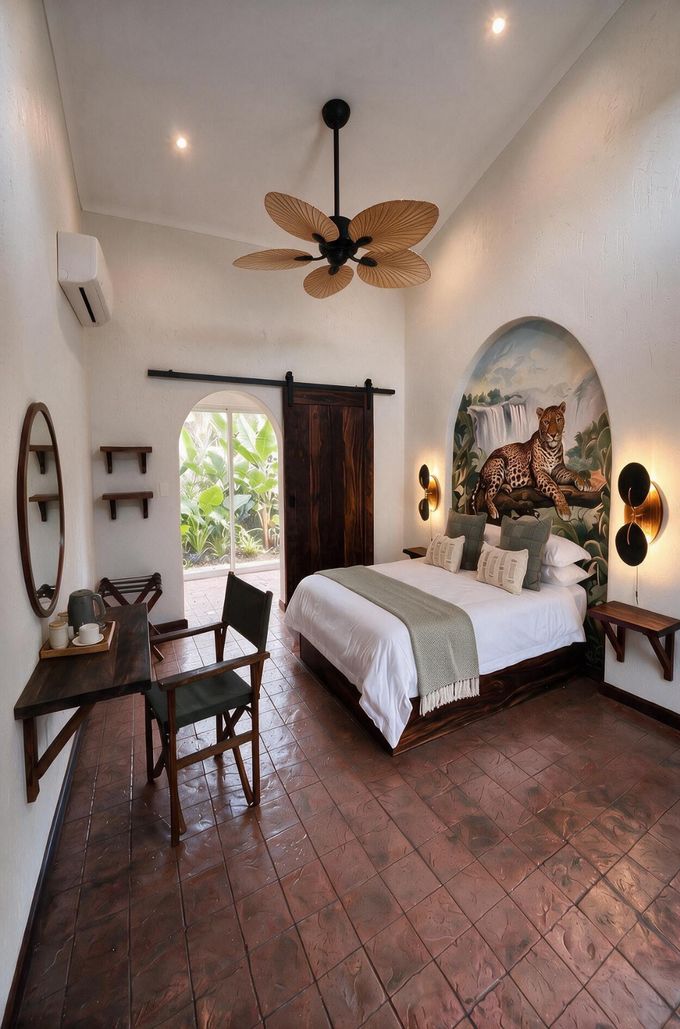 A guest room with a locally painted mural, terracotta floors and mukwa furniture.